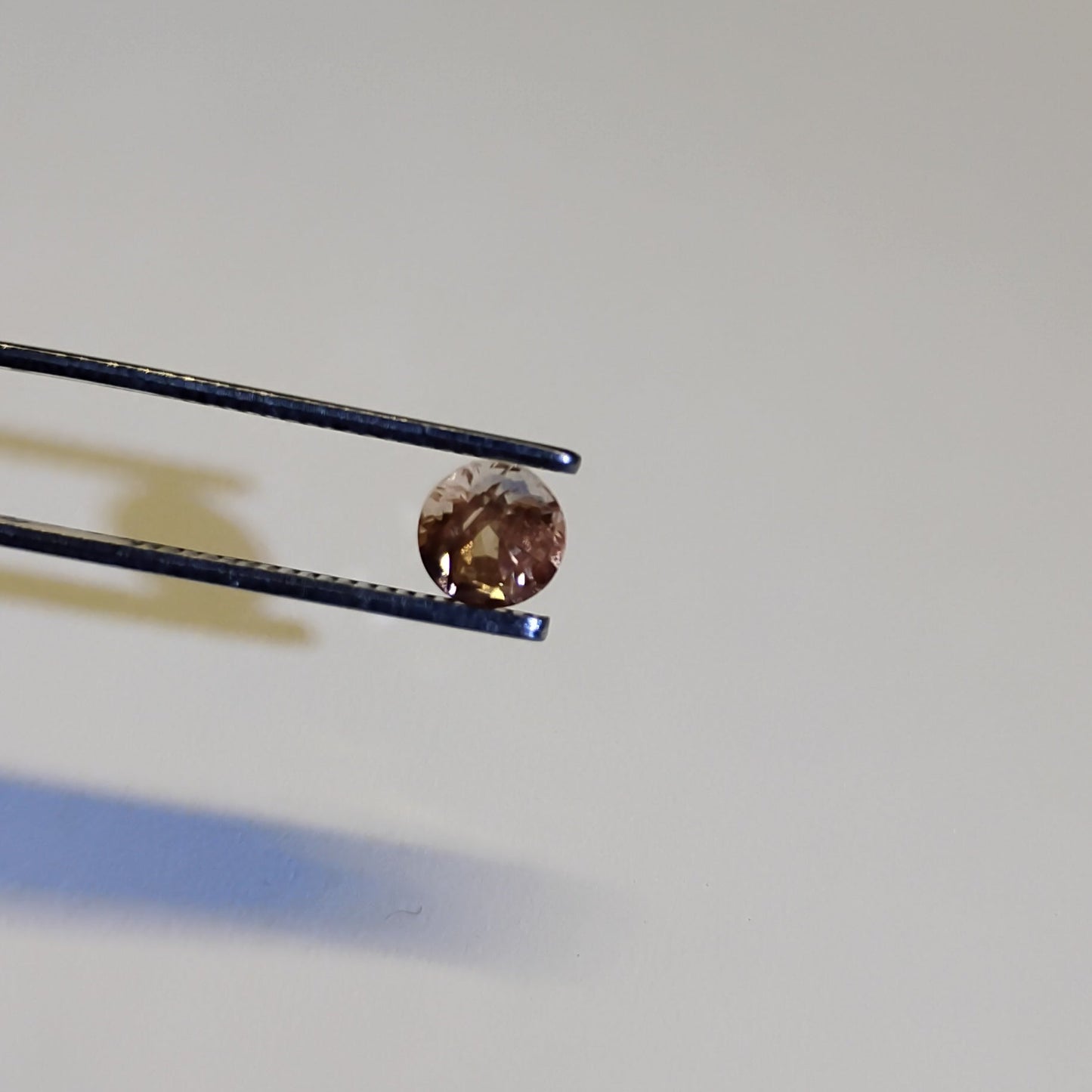 Peach Schiller Faceted Oregon Sunstone 0.80 Carat 5.4mm Round