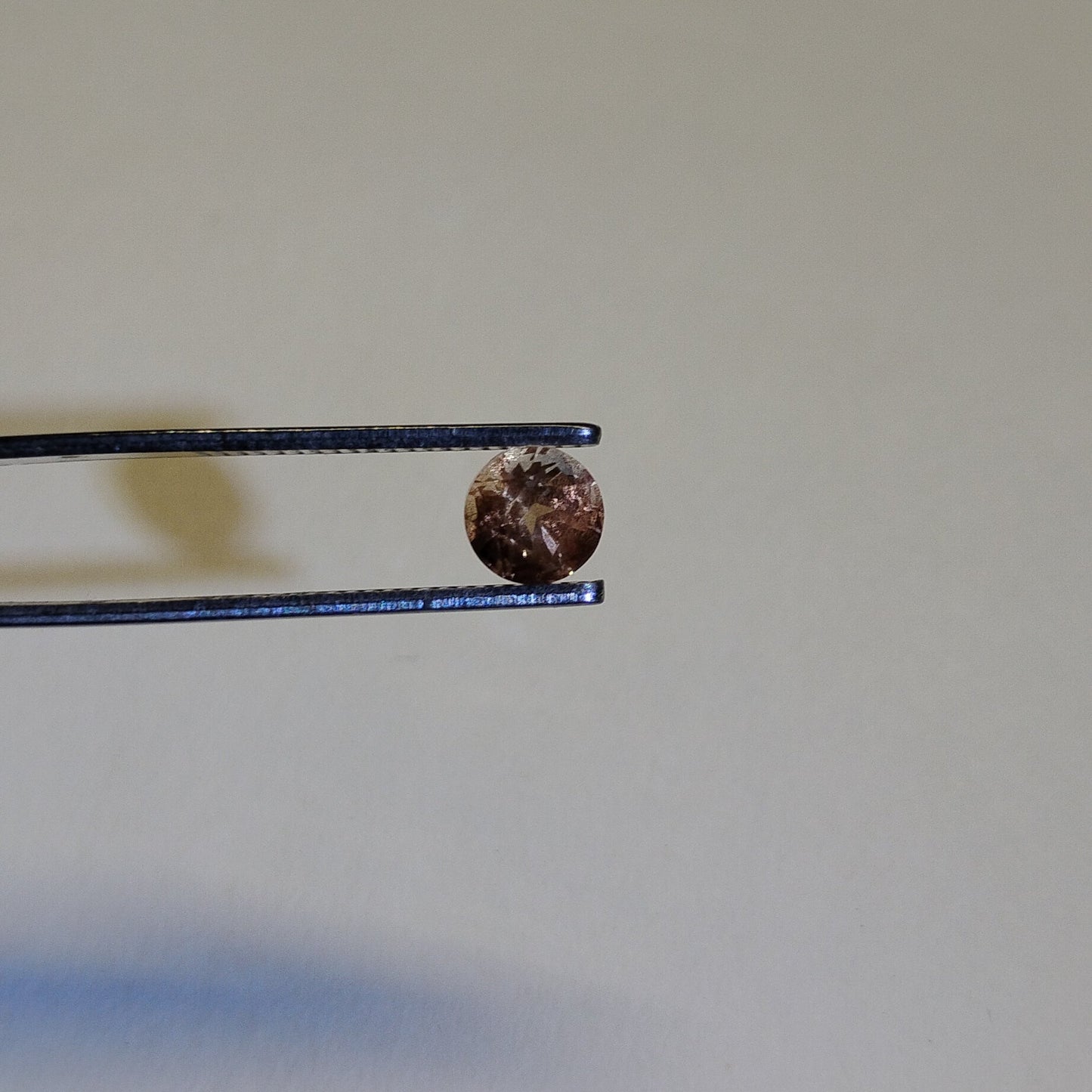 Peach Schiller Faceted Oregon Sunstone 0.80 Carat 5.4mm Round